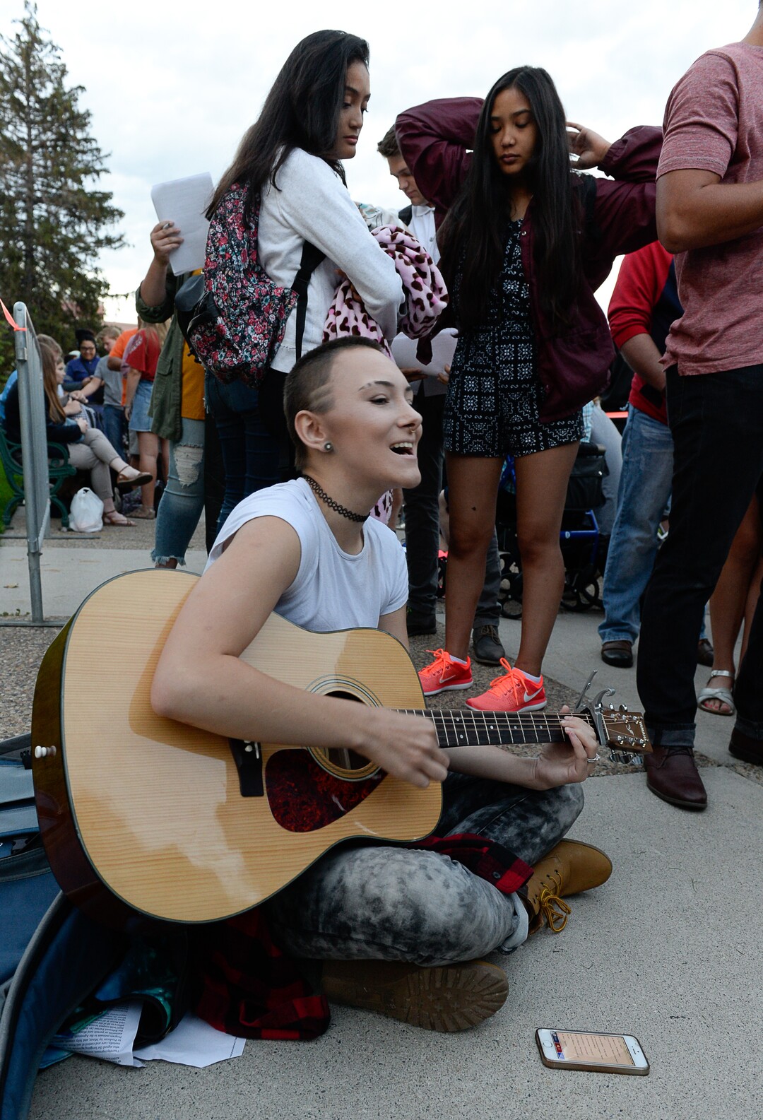 (Francisco Kjolseth  |  The Salt Lake Tribune)  Hannah Weber of Springville warms up her vocals before a shot at  "American Idol" as people line up to audition in downtown Provo on Wednesday morning, Aug. 23, 2017, for the revived show, which is moving to ABC and will air in early 2018.