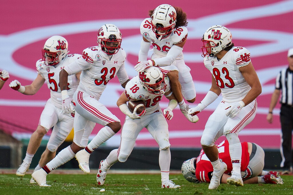(Trent Nelson | The Salt Lake Tribune) Utah Utes wide receiver Britain Covey (18) collides with a teammate while running a kick return for a touchdown as the Utah Utes face the Ohio State Buckeyes at the Rose Bowl in Pasadena, Calif., on Saturday, Jan. 1, 2022.