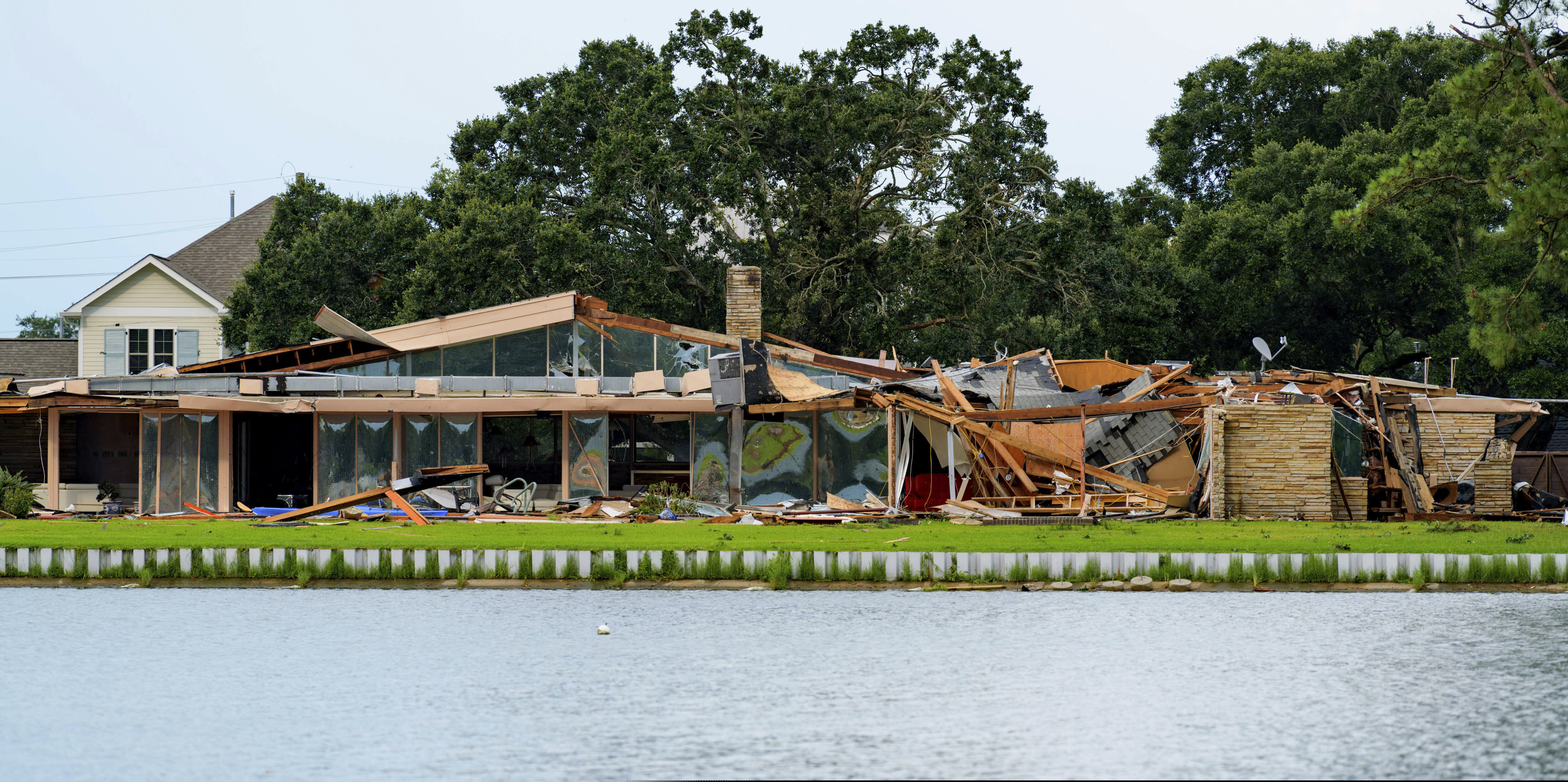 (Matthew Hinton | AP Photo) This photo shows the damaged home of Eric and Indra Ehlenberger in New Orleans on Wednesday, July 10, 2019, following a storm that went through the area. The storm swamped New Orleans streets and paralyzed traffic Wednesday as concerns grew that even worse weather was on the way: a possible hurricane that could strike the Gulf Coast and raise the Mississippi River to the brim of the city’s protective levees.