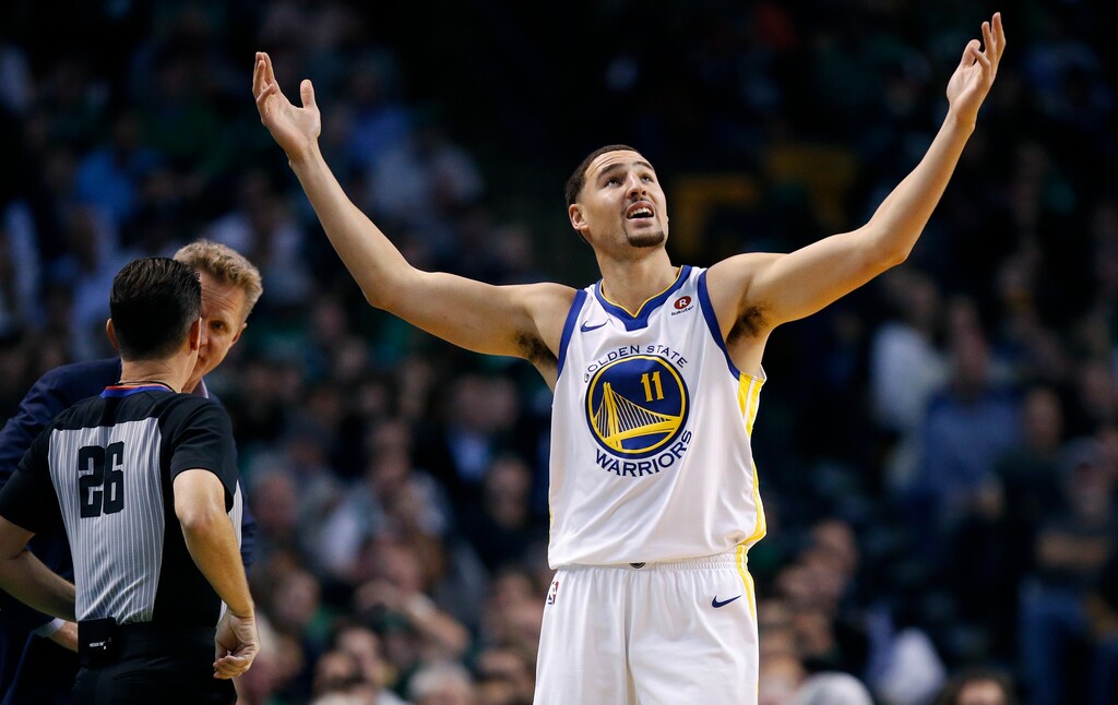 Golden State Warriors' Klay Thompson (11) protests a call during the fourth quarter of an NBA basketball game against the Boston Celtics in Boston, Thursday, Nov. 16, 2017. The Celtics won 92-88. (AP Photo/Michael Dwyer)