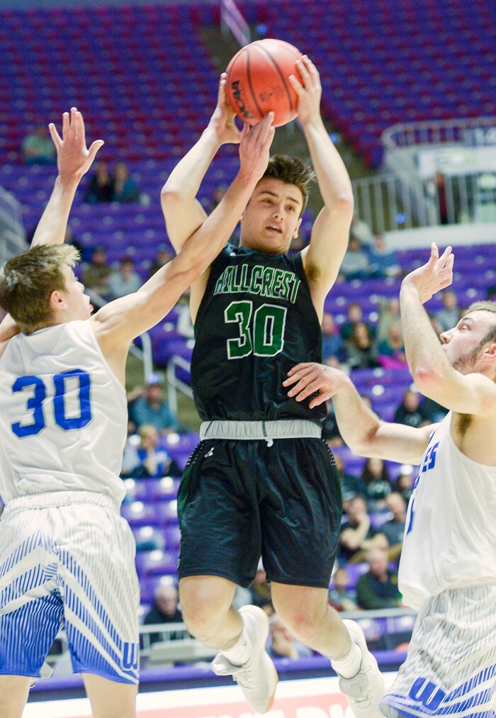 (Leah Hogsten  |  The Salt Lake Tribune) Hillcrest's Brox Ashby (30) drives to the net around Fremont's Dallin Hall (30). Fremont faces Hillcrest in the 6A High School Boys' Basketball Tournament opening game at Weber State UniversityÕs Dee Events Center in Ogden, Tuesday, Feb. 27, 2018. 