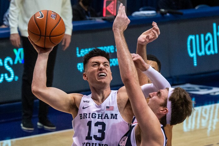 (Rick Egan | The Salt Lake Tribune)  Brigham Young Cougars guard Alex Barcello (13) shoots over Gonzaga Bulldogs forward Drew Timme (2), in West Coast Conference Basketball action between the Brigham Young Cougars and the Gonzaga Bulldogs at the Marriott Center in Provo, on Monday, Feb. 8, 2021.