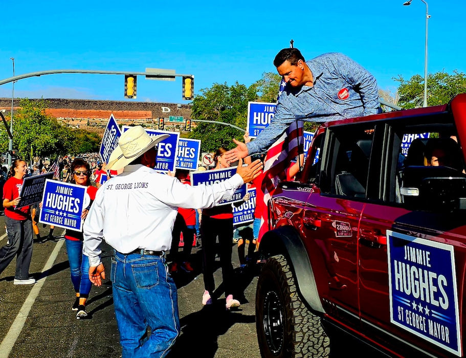 (Jimmie Hughes) St. George mayoral candidate Jimmie Hughes greets people at the Dixie Roundup Rodeo Parade.