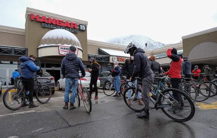 (Francisco Kjolseth  | The Salt Lake Tribune) People gather arrive at Hangar 15 bicycle shop in Millcreek to tell stories of Louis Holian, Sarah Moughamian and Thomas Steinbrecher on Sunday, Feb. 14, 2021, three of the four who died in an avalanche on Saturday, Feb. 6. Stephanie Hopkins who was in a different group that day was swept up in the same avalanche.