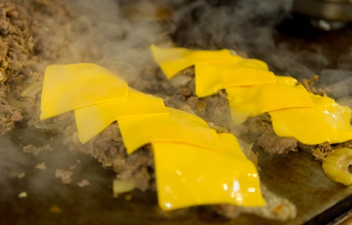 (Trent Nelson  |  Tribune File Photo)  Cheesesteak on the grill at Moochie's Meatballs in Midvale.