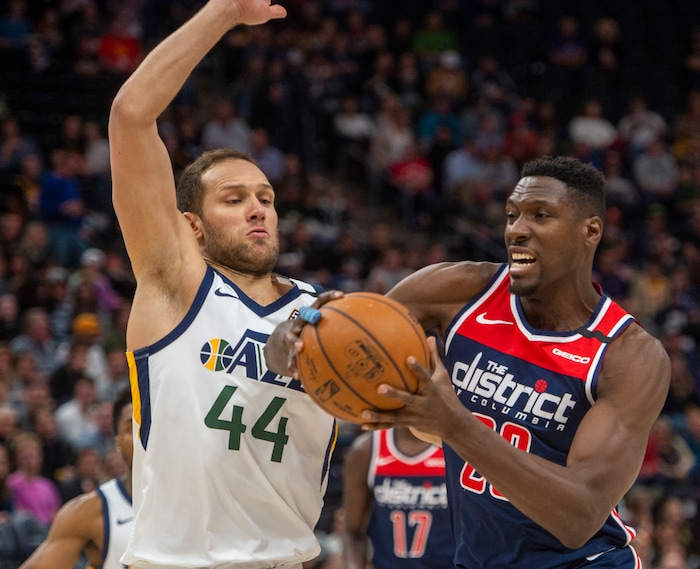 (Rick Egan  |  The Salt Lake Tribune)  Washington Wizards center Ian Mahinmi (28) goes in for a shot as Utah Jazz forward Bojan Bogdanovic (44) defends, in NBA action between the Utah Jazz and the Washington Wizards, in Salt Lake City, Friday, February 28, 2020