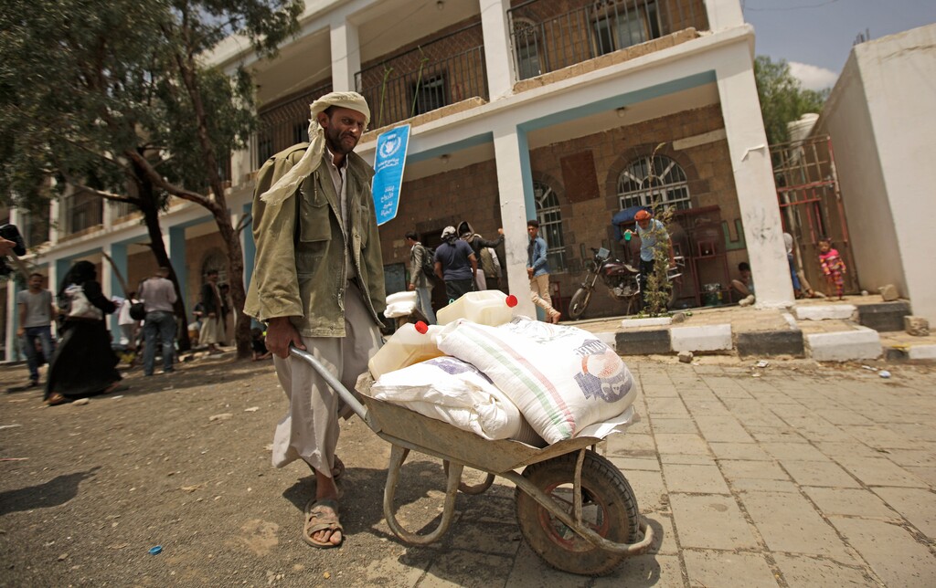 (Hani Mohammed | AP file photo) A displaced Yemeni man receives food aid provided by the World Food Program, at a school in Sanaa, Yemen, Aug. 25, 2019. The World Food Program won the Nobel Peace Prize on Friday, Oct. 9, 2020 for its efforts to combat hunger amid the coronavirus pandemic, recognition that shines light on vulnerable communities across the Middle East and Africa that the U.N. agency seeks to help, those starving and living in war zones that may rarely get the world’s attention.