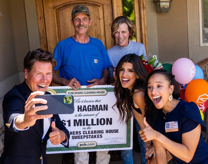 (Rick Egan | The Salt Lake Tribune) Members of the Prize Patrol from Publishers Clearing House, from left,  Howie Guja, Danielle Lam and Bianca Quinnonez, take a selfie with Ed and Denise Hagman, after delivering the news that the Hagman's won $1,000,000, at their home in Herriman, on Friday, May 28th