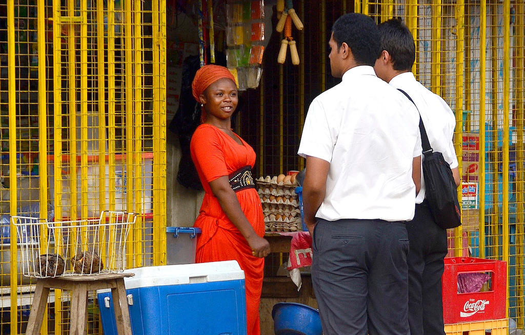 (Mike Stack  |  Special to The Salt Lake Tribune) In this 2014 file photo, missionaries talk to a shopkeeper in Accra, Ghana.