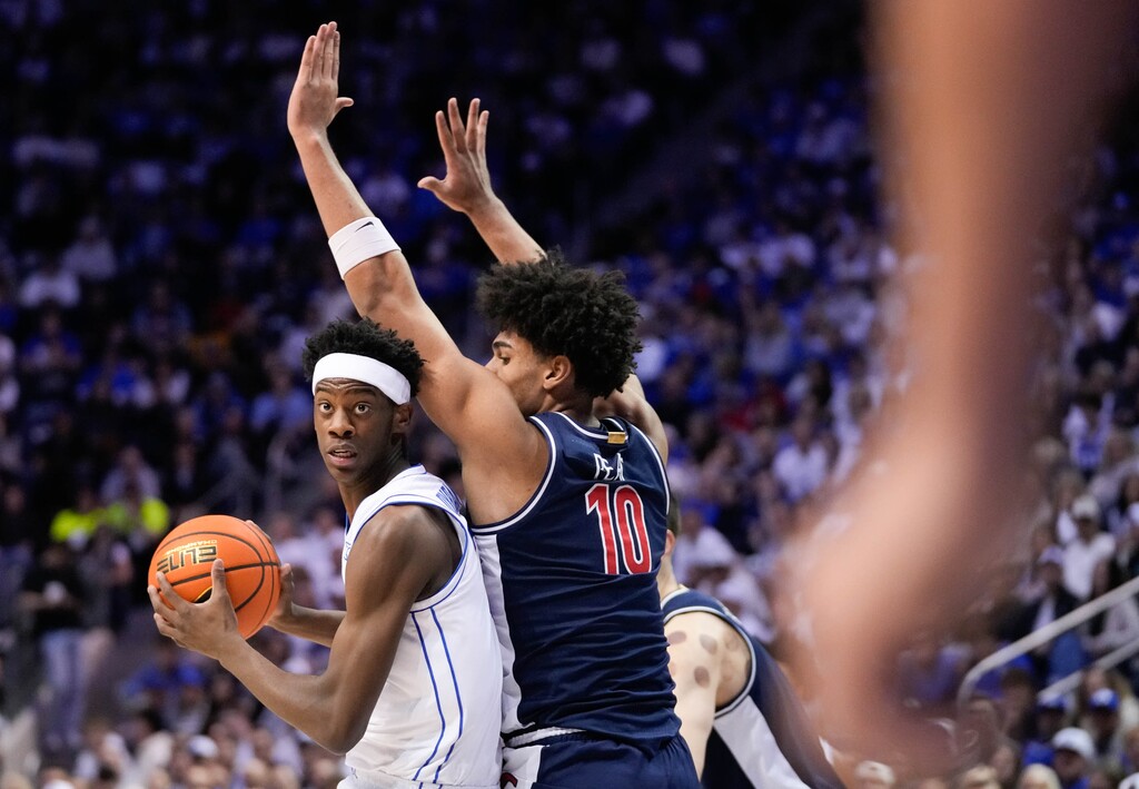 (Francisco Kjolseth | The Salt Lake Tribune) BYU Cougars forward AJ Dybantsa (3) spins around Arizona Wildcats forward Koa Peat during a game last season.