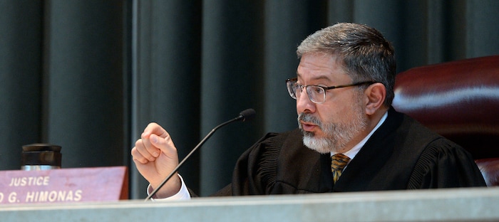 ((Al Hartmann  |  The Salt Lake Tribune) 	
Utah Supreme Court Justice Deno Himonas questions federal public defender Charlotte Merrill at the Utah Supreme Court Wednesday Jan. 10. The court heard arguments regarding Anthony Michael Archuleta, 55, who has been on death row since his conviction in 1989 for the Nov. 21, 1988, torture slaying of Gordon Ray Church, a 28-year-old Southern Utah State College theater student, at a remote location in Millard County. In separate trials, Archuleta and co-defendant Lance Conway Wood each were convicted of capital murder. Wood was sentenced to life in prison. Archuleta was sentenced to death. 