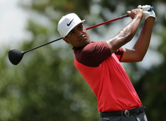 Tony Finau watches his tee shot on the third hole during the third round of the PGA Championship golf tournament at the Quail Hollow Club Saturday, Aug. 12, 2017, in Charlotte, N.C. (AP Photo/Chuck Burton)