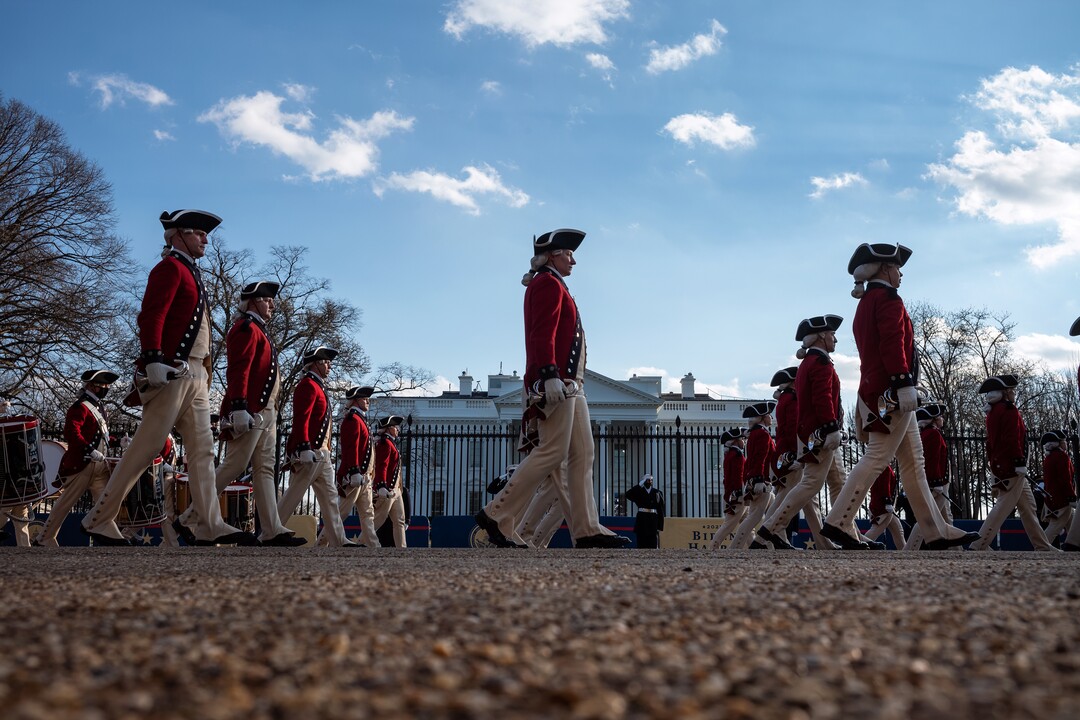 Members of the Old Guard Fife and Drum Corps march in front of the White House in Washington during the Presidential Escort, part of Inauguration Day ceremonies on Wednesday, Jan. 20, 2021. (Todd Heisler/The New York Times)