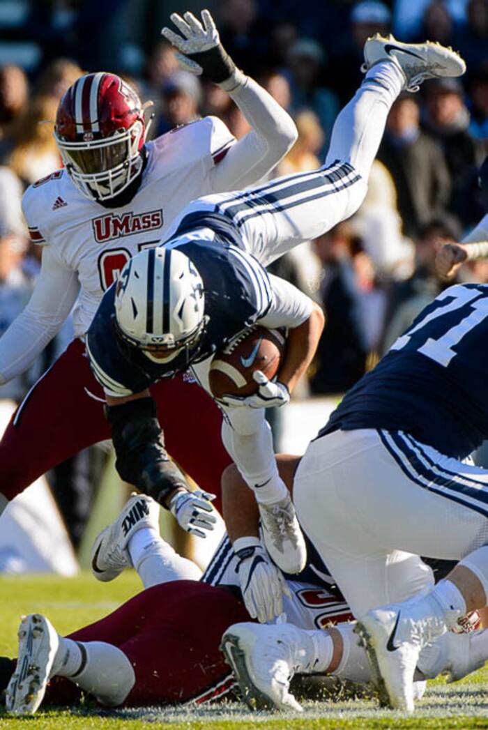 (Trent Nelson | The Salt Lake Tribune)  Brigham Young Cougars running back KJ Hall (24) dives for yardage as BYU hosts the University of Massachusetts, NCAA football in Provo, Saturday November 18, 2017.