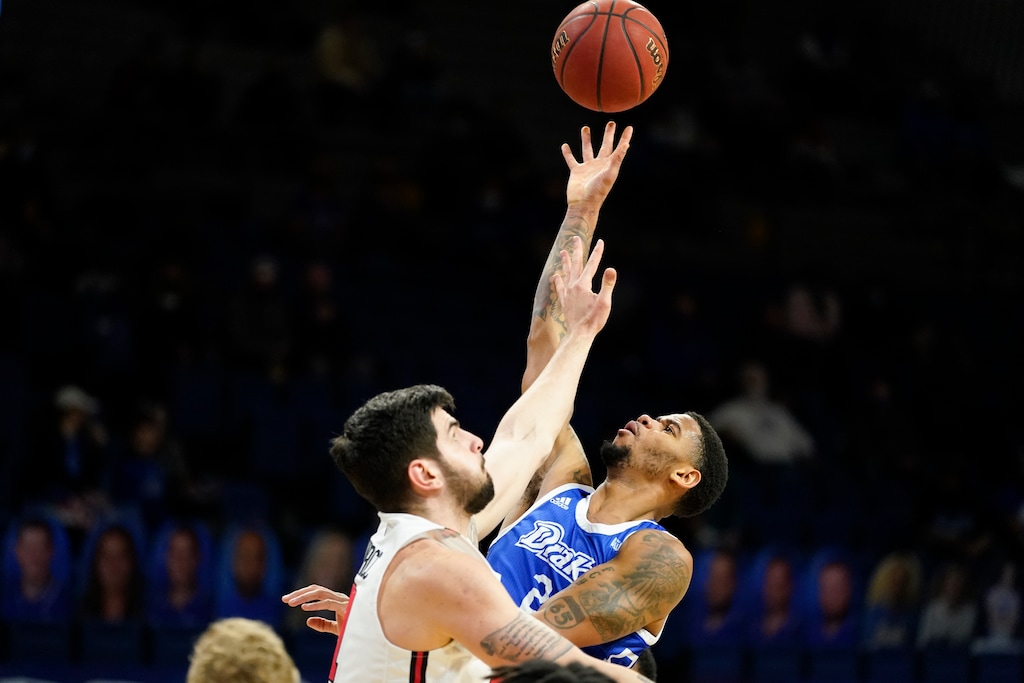 Drake forward Tremell Murphy shoots over Illinois State forward Dusan Mahorcic, left, during the first half of an NCAA college basketball game, Monday, Feb. 1, 2021, in Des Moines, Iowa. Drake won 95-60. (AP Photo/Charlie Neibergall)