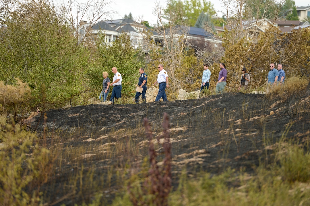 Leah Hogsten  |  The Salt Lake Tribune  l-r Salt Lake City Mayor Jackie Biskupski and Salt Lake City Fire Chief Karl Lieb tour the burned areas near Salt Lake City’s Ensign Peak. Five people were injured and one home was damaged by a fast-moving grass fire on Columbus Court, Tuesday, July 24, 2018. Forty homes were evacuated as flames spread through about 100 acres. Between 50 and 60 firefighters responded to the fire.