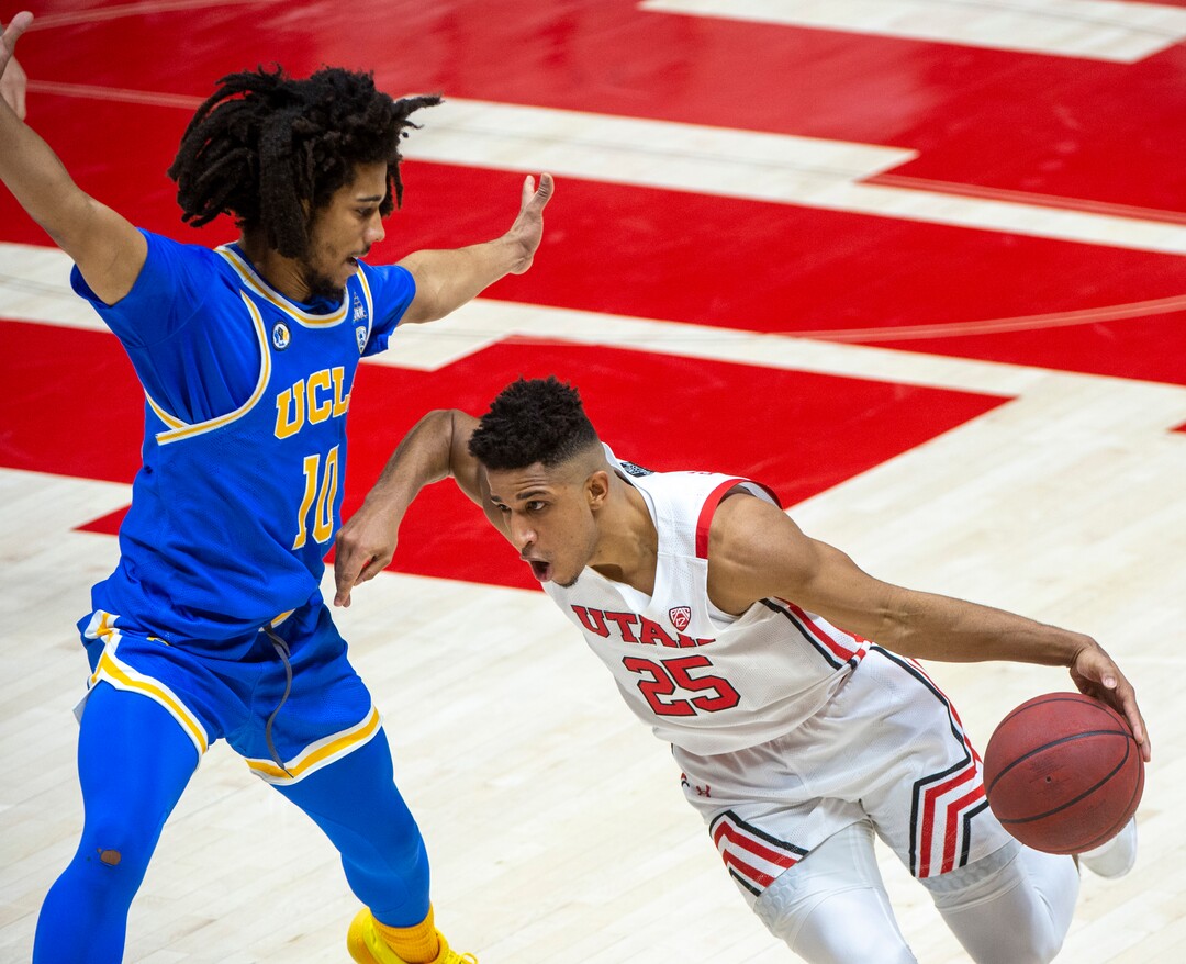(Rick Egan | The Salt Lake Tribune)  Utah Utes guard Alfonso Plummer (25) takes the ball downcourt, as UCLA Bruins guard Tyger Campbell (10) defends, in PAC-12 basketball action at the Jon M. Huntsman Center, on Thursday, Feb. 25, 2021.