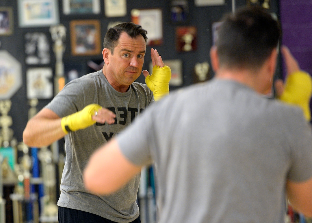 (Al Hartmann  |  The Salt Lake Tribune) House Speaker Greg Hughes works on his boxing form in the mirror during a workout at the Flash Academy gym in Holladay Tuesday August 29.  He's among a handful of local politicians, police and lobbyists who will box in a series of charity matches to benefit a national group that works to end domestic violence.