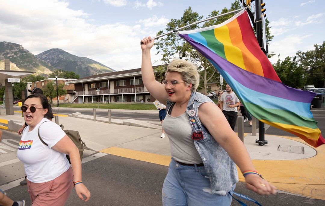 (Rick Egan | The Salt Lake Tribune) Marches tried to beat the light as they march with BYU students, friends and allies, in a Pride March from Joaquin Park to Kiwanis Park, in Provo, on Monday, June 28, 2021.
