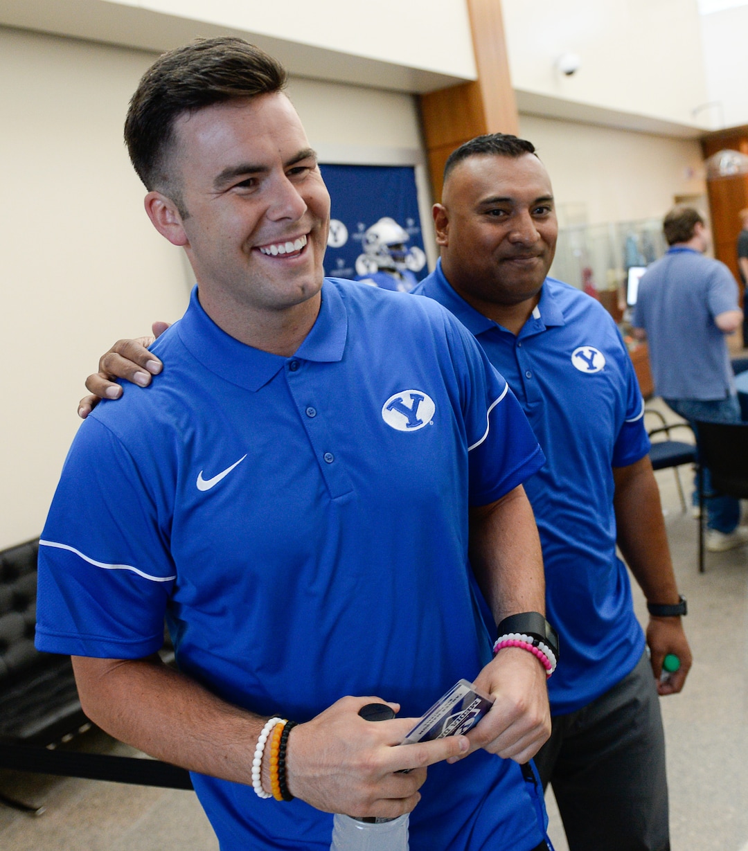 Francisco Kjolseth | The Salt Lake TribuneBYU quarterback Tanner Mangum gets a warm welcome from head coach Kalani Sitake during BYU Football Media Day at BYU Broadcasting in Provo on Friday, June 23, 2017.