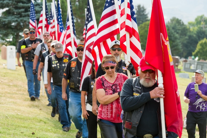 (Alex Gallivan  |  Special to The Tribune) Marine Pfc. Robert K. Holmes, who died 77 years ago aboard the USS Oklahoma during the attack on Pearl Harbor, is laid to rest in the Salt Lake City Cemetery, Monday, Aug. 20, 2018.