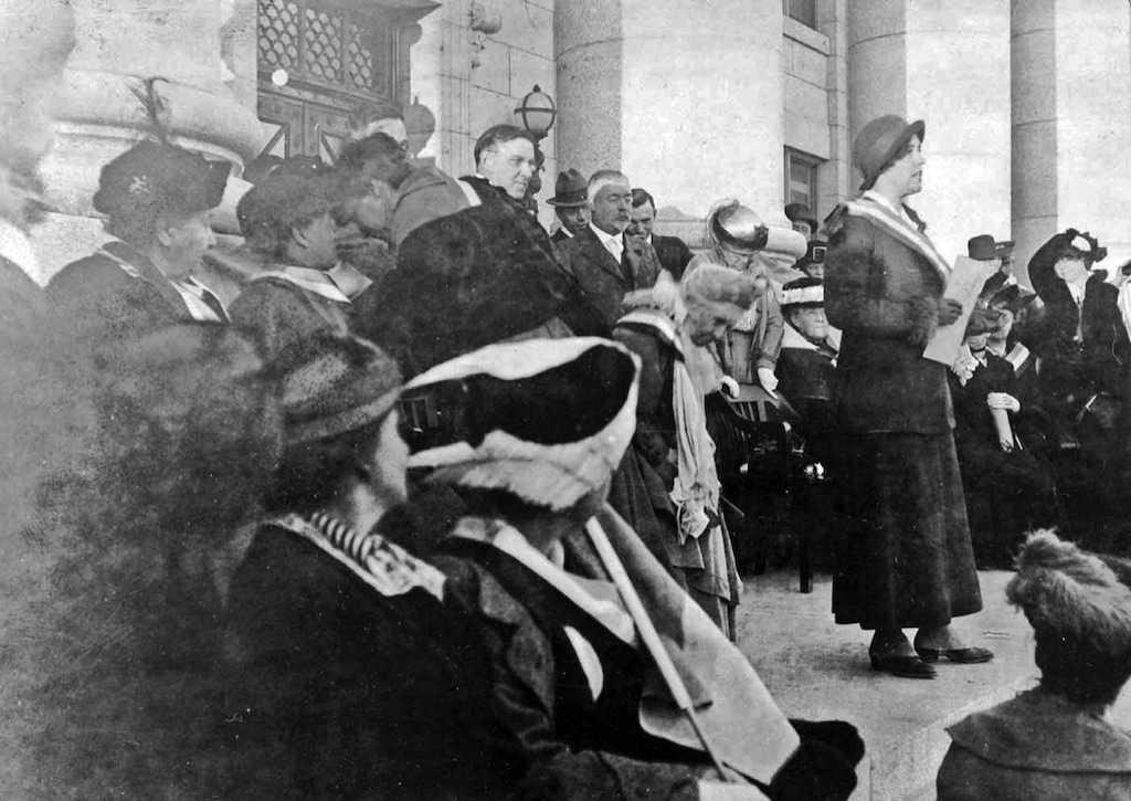 (National Woman's Party Collection, Belmont-Paul Women's Equality National Monument, Washington, D.C.)
Sara Bard Field speaking at a women's suffrage rally at the Utah Capitol, Oct. 4, 1915. Emmeline Wells is the woman stooped over to Field's right. Utah Gov. William Spry (with beard) and Salt Lake City Mayor Samuel Park are behind her.