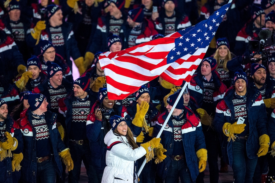 (Chris Detrick  |  The Salt Lake Tribune)  U.S. luger Erin Hamlin carries the American flag during the Pyeongchang 2018 Winter Olympics opening ceremony at Olympic Stadium Friday, February 9, 2018.  