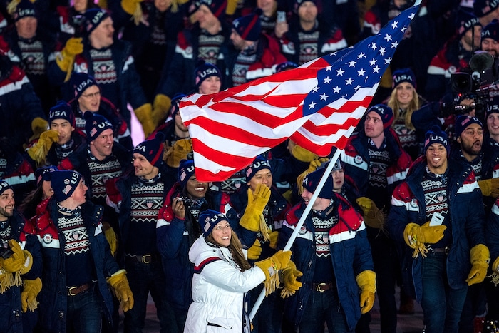 (Chris Detrick  |  The Salt Lake Tribune)  U.S. luger Erin Hamlin carries the American flag during the Pyeongchang 2018 Winter Olympics opening ceremony at Olympic Stadium Friday, February 9, 2018.  