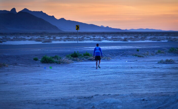 (Scott Sommerdorf | The Salt Lake Tribune)
Alex Doolan sets out on the last 3.8 miles as the sun rises at the Salt Flats 100 Endurance Run, Saturday, May 5, 2018. Doolan finished the race in 8th place.
