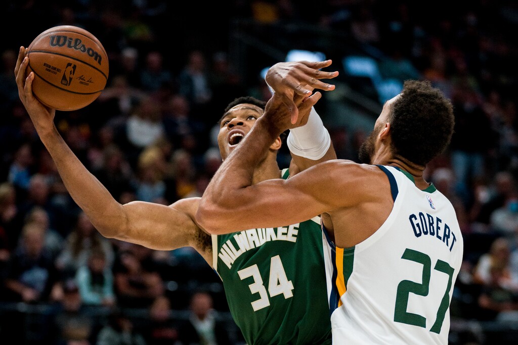 (Trent Nelson  |  The Salt Lake Tribune) Utah Jazz center Rudy Gobert (27) defends Milwaukee Bucks forward Giannis Antetokounmpo (34) as the Utah Jazz host the Milwaukee Bucks, NBA basketball in Salt Lake City on Wednesday, Oct. 13, 2021.