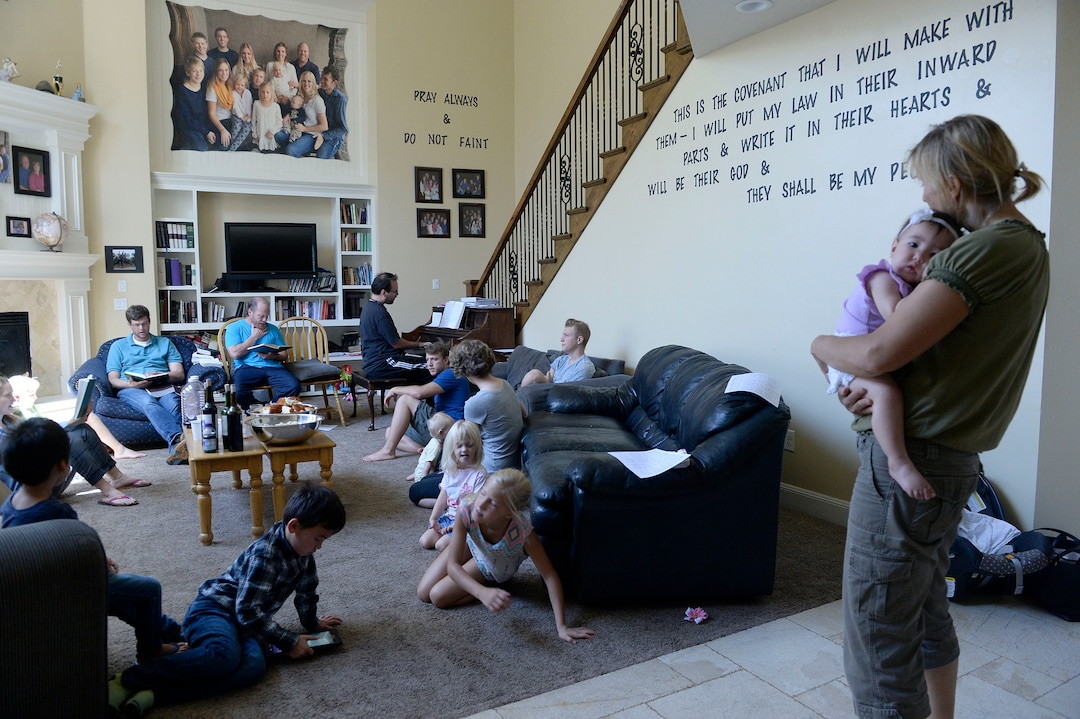 (Al Hartmann  |  The Salt Lake Tribune)
Believers in Denver Snuffer's Remnant movement gather in a Sandy home for a fellowship meeting Sunday, Aug. 13, to sing songs and partake of the sacrament.