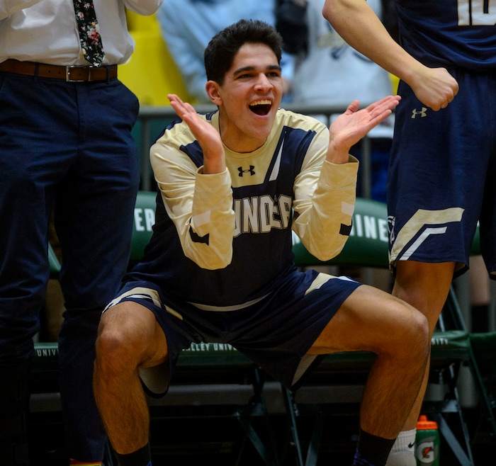(Steve Griffin | The Salt Lake Tribune) Westlake's Andrew Van Mondfrans celebrates from the bench as Westlake pulls away from Riverton during the 6A basketball playoff game at the Utah Valley UniversityÕs UCCU Center in Provo Tuesday Feb. 27, 2018.