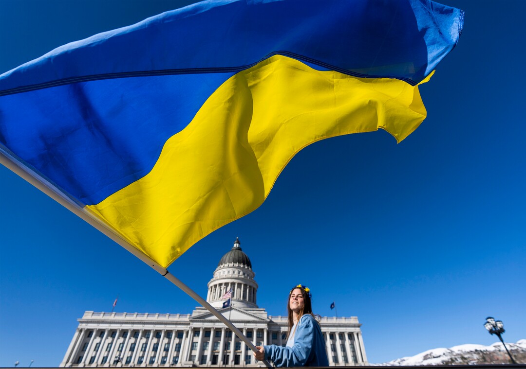 (Rick Egan | The Salt Lake Tribune) Katya Osipenko, 17, from Orem, waves the Ukrainian flag, during a protest against Russia's invasion of Ukraine, organized by the Utah Ukrainian association, on Saturday, March 12, 2022.