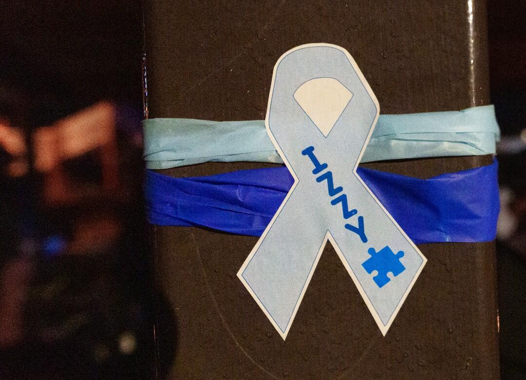 (Leah Hogsten | The Salt Lake Tribune) Blue autism awareness ribbons were tied around the gazebo as hundreds mourned the death of 10-year-old Isabella "Izzy" Tichenor, Nov. 9, 2021 during a vigil at Foxboro Hollow Park in North Salt Lake.
