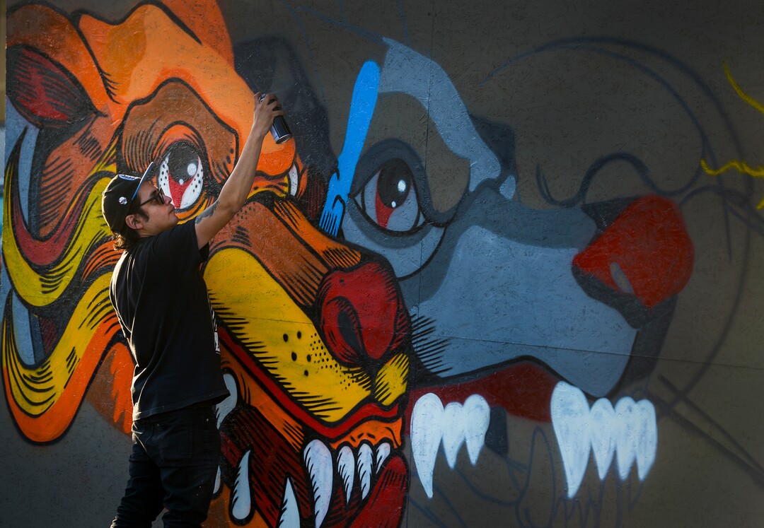 (Leah Hogsten | The Salt Lake Tribune) Muralist Eduardo Bastida from Mexico City, who goes by the name of "Trasheer" paints at the 2nd annual Mural Fest sponsored by South Salt Lake Arts Council and Utah Arts Alliance. Ten murals were created in South Salt Lake's community between 2100 and 2400 South off of West Temple, May 11, 2019.