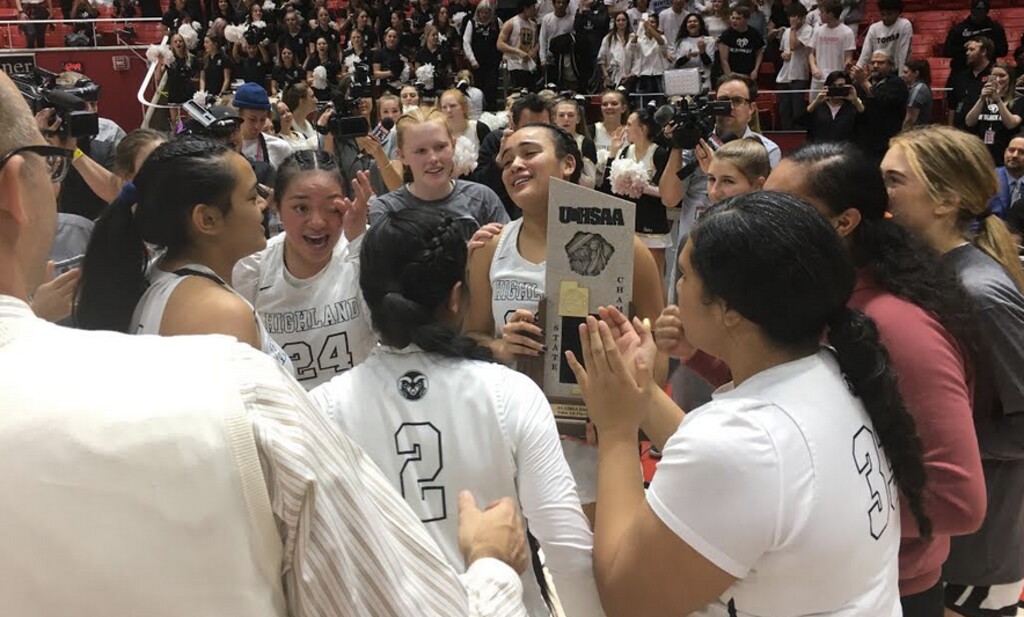(Tom Wharton | The Salt Lake Tribune) Highland's girls basketball team members celebrate winning the state 5A basketball championship with their fans on at the Huntsman Center on Saturday, Feb. 29, 2020.