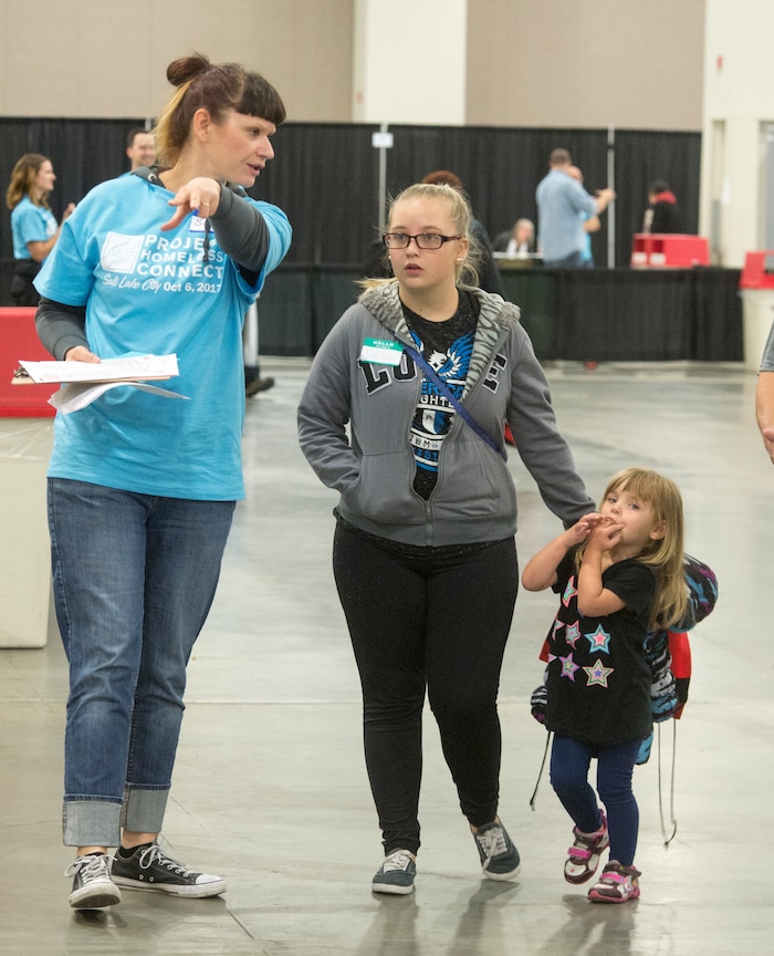 (Rick Egan  |  The Salt Lake Tribune)  Hailey Bartlett gets directions from volunteer Susan Chamberlain during Project Homeless Connect on Friday, October 6, 2017. The one-day event in Salt Lake City brings together community volunteers to provide services for individuals and families experiencing homelessness.