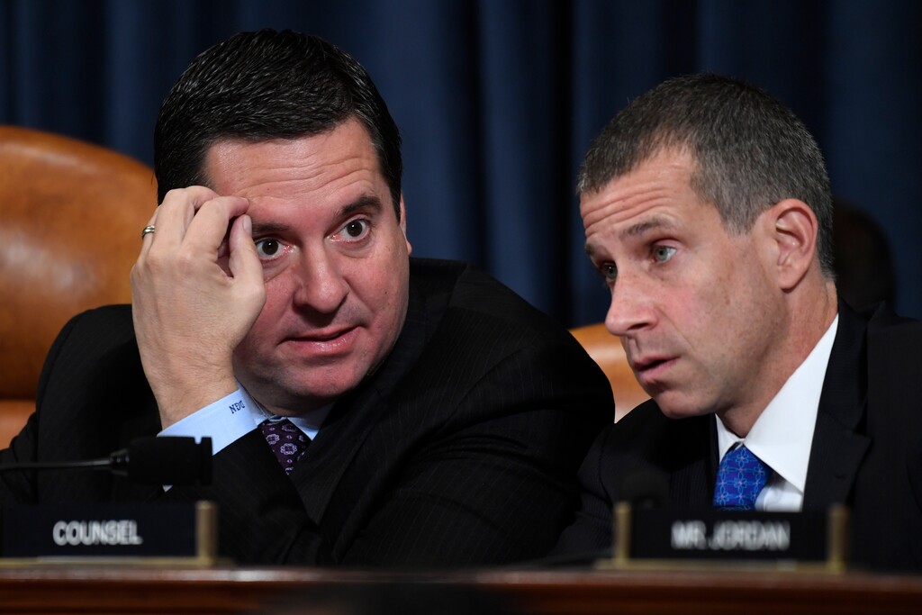 Ranking member Rep. Devin Nunes of Calif., and Steve Castor, the Republican staff attorney, right, talk as former White House national security aide Fiona Hill, and David Holmes, a U.S. diplomat in Ukraine, testify before the House Intelligence Committee on Capitol Hill in Washington, Thursday, Nov. 21, 2019, during a public impeachment hearing of President Donald Trump's efforts to tie U.S. aid for Ukraine to investigations of his political opponents.(AP Photo/Susan Walsh)