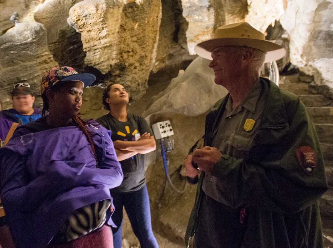 (Rick Egan  |  The Salt Lake Tribune)  Maryan asks Ranger Royce Shelley a question, during a tour of Timpanogos Cave with the YouthWorks program, Thursday, Aug. 3, 2017.