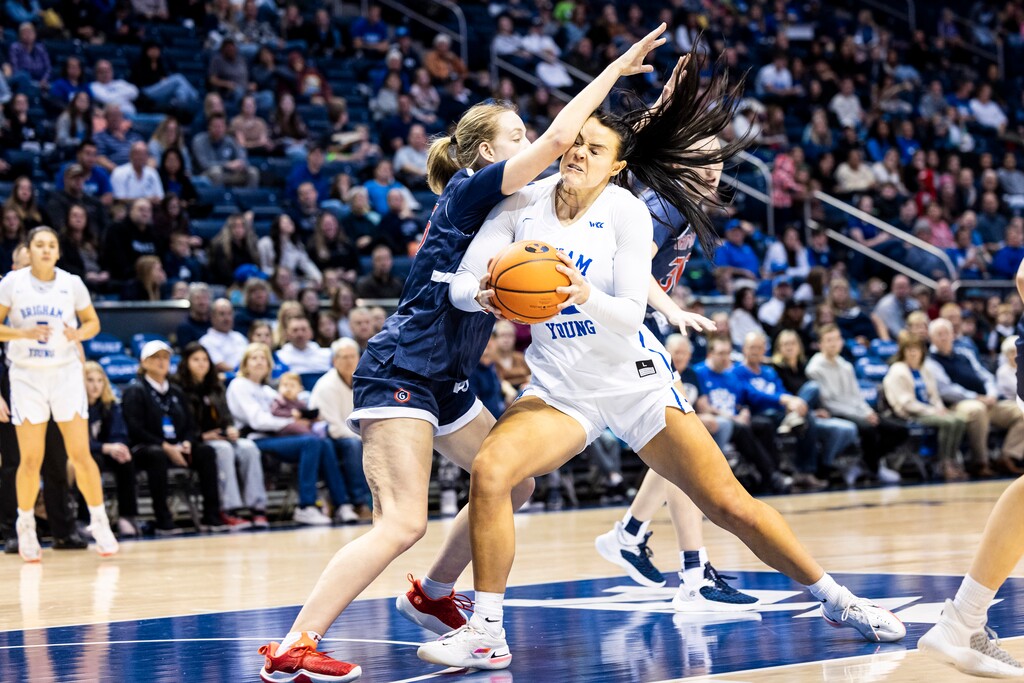 (BYU Athletics) BYU women's basketball center Lauren Gustin muscles through a defender during a game against St. Mary's on Dec. 31, 2022 at the Marriott Center in Provo.