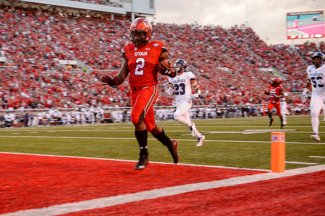 (Trent Nelson | The Salt Lake Tribune)  Utah Utes running back Zack Moss (2) scores a touchdown as the University of Utah Utes host the Weber State Wildcats, Thursday Aug. 30, 2018 at Rice-Eccles Stadium in Salt Lake City.