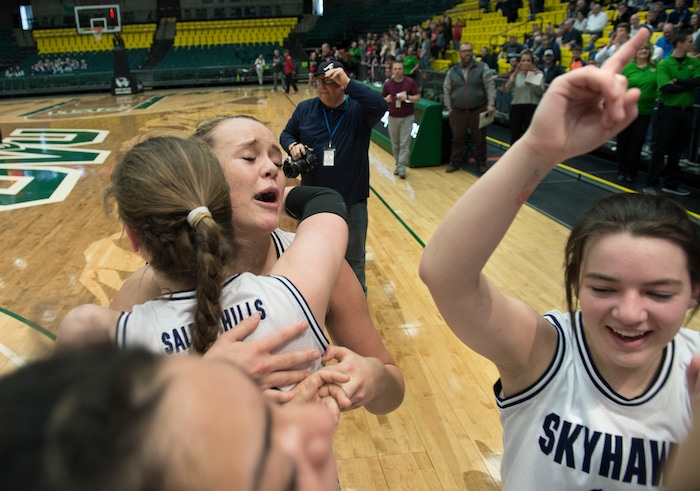 Scott Sommerdorf | The Salt Lake TribuneLauren Gustin celebrates with team mates after winning the state title. Salem Hills beat Hurricane 57-35 for the 4A girl's title, Saturday, March 3, 2018.