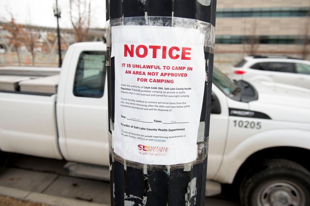 (Jeremy Harmon  |  The Salt Lake Tribune) A sign informs people camping around the downtown library of a health department clean up planned for Thursday, January 9, 2020. 
