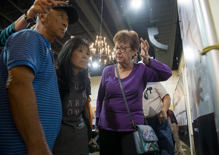 (Leah Hogsten | The Salt Lake Tribune) l-r "Something needs to be done," said Alan Aoki with his wife Janice, while talking with Kris Baker about the UDOT plan.
Utah Department of Transportation (UDOT) representatives fielded hundreds of questions from concerned Davis County residents seeking information about the US-89 State Environmental Study and the proposal to convert US-89 in Davis County into a freeway. The formal public comment period continues through Monday September 25.