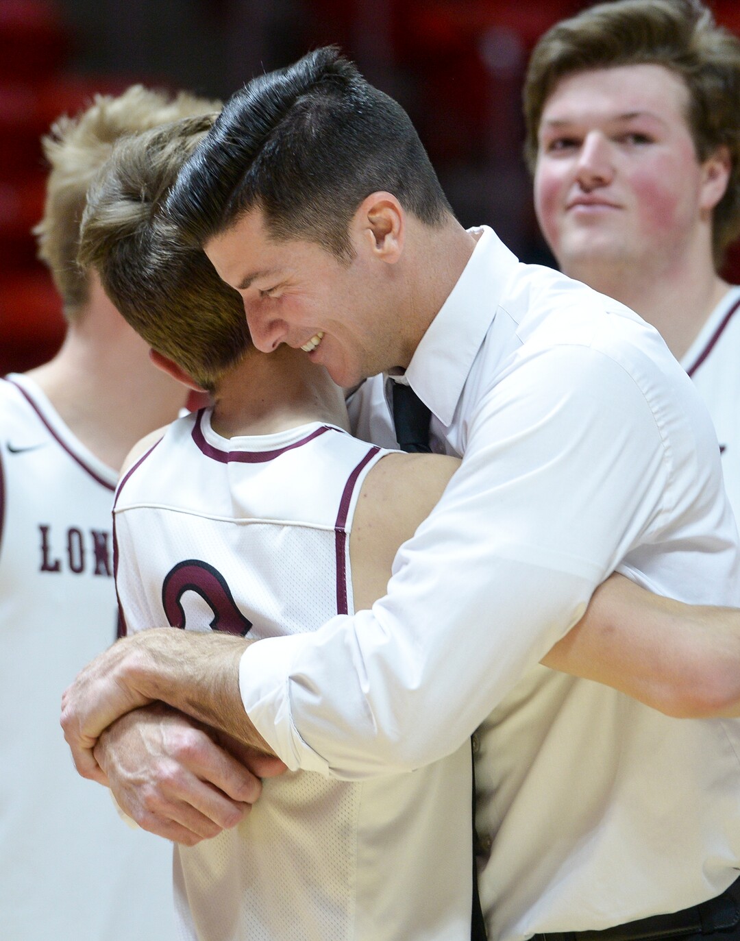 (Leah Hogsten  |  The Salt Lake Tribune) Lone Peak's head coach David Evans hugs Lone Peak's Steven Ashworth (03). Lone Peak defeated Pleasant Grove 61-44 to win the 6A High School BoysÕ Basketball Tournament Championship at the Jon M. Huntsman Center in Salt Lake City, Saturday, March 3, 2018. 