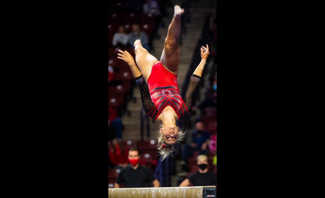 (Rick Egan | The Salt Lake Tribune) Adrienne Randall performs on the beam for Utah in the Best of Utah gymnastics meet at the Maverik Center on Saturday, Jan. 9, 2021.