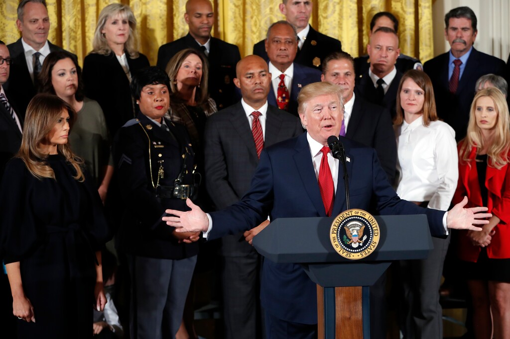 President Donald Trump speaks during an event to declare the opioid crisis a national public health emergency in the East Room of the White House, Thursday, Oct. 26, 2017, in Washington. First lady Melania Trump listens at left.  (AP Photo/Pablo Martinez Monsivais)