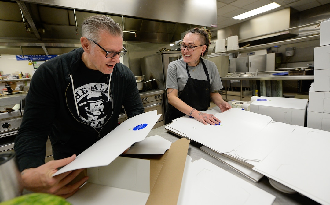(Francisco Kjolseth  |  The Salt Lake Tribune)  Scott Covington, administrative assistant at Flourish Bakery and intern Tristin Arellano fold pie boxes as they fulfill a large order as part of their "Pie it Forward" program before the Thanksgiving holiday on Tuesday, Nov. 26. Flourish Bakery needs to find a new home before Christmas. The non-profit bakery teaches those who have been incarcerated or recovering from substance abuse the art of baking. The skills they learn help them get a job and become financially independent. The bakery has been housed at SLCC's South City campus, but the college has said they can no longer use the space.
