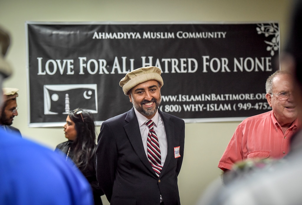 (Bill O'Leary | The Washington Post) Faheem Younus greets visitors to a mosque for a community meeting about the development.