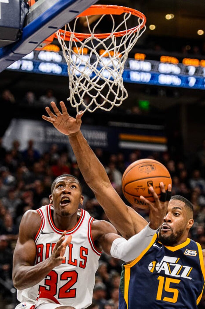 (Trent Nelson | The Salt Lake Tribune)  Chicago Bulls guard Kris Dunn (32) defended by Utah Jazz forward Derrick Favors (15) as the Utah Jazz host the Chicago Bulls, NBA basketball in Salt Lake City Wednesday November 22, 2017.